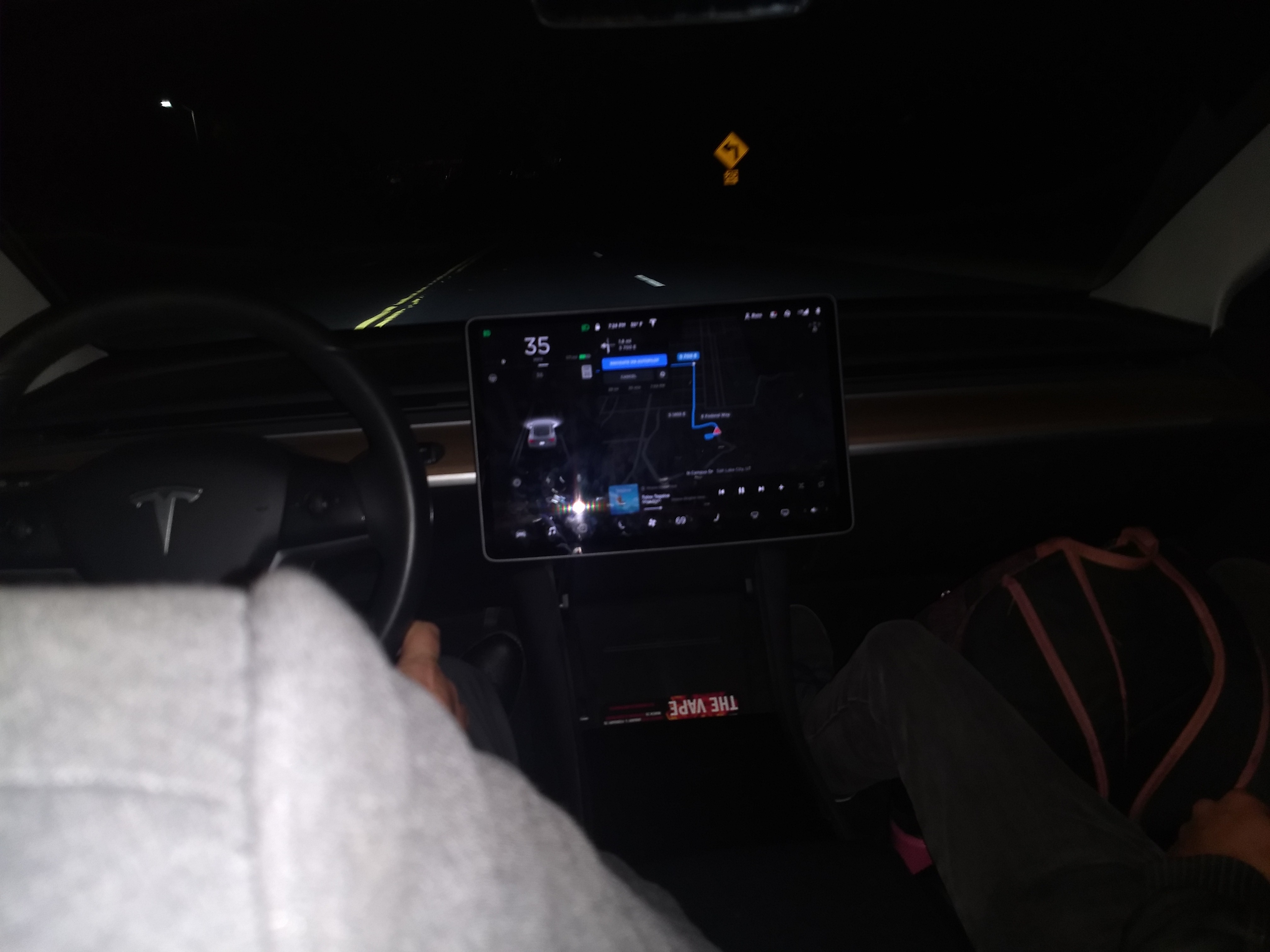Interior of Tesla, with a gigantic touch-screen console and large street map view