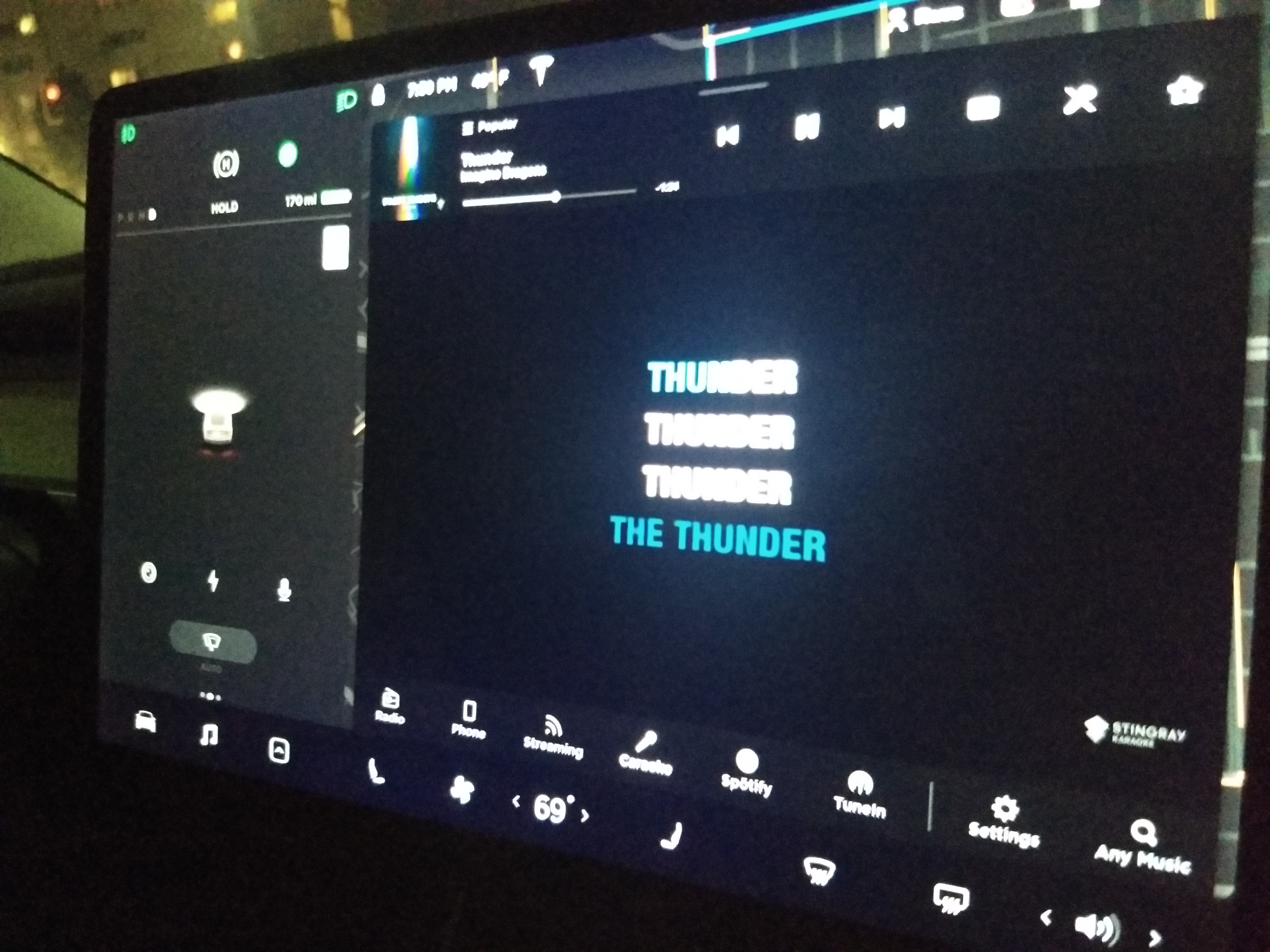 Tesla console running Caraoke: "Thunder" by Imagine Dragons